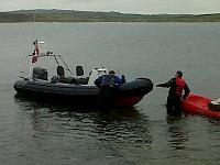 Getting ready to set mooring buoy for the season - tyre filled with concrete on kayak.