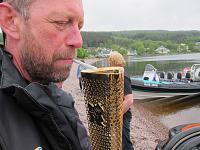 Lighting fag with olympic torch after delivery on Lochness leg of torch tour
